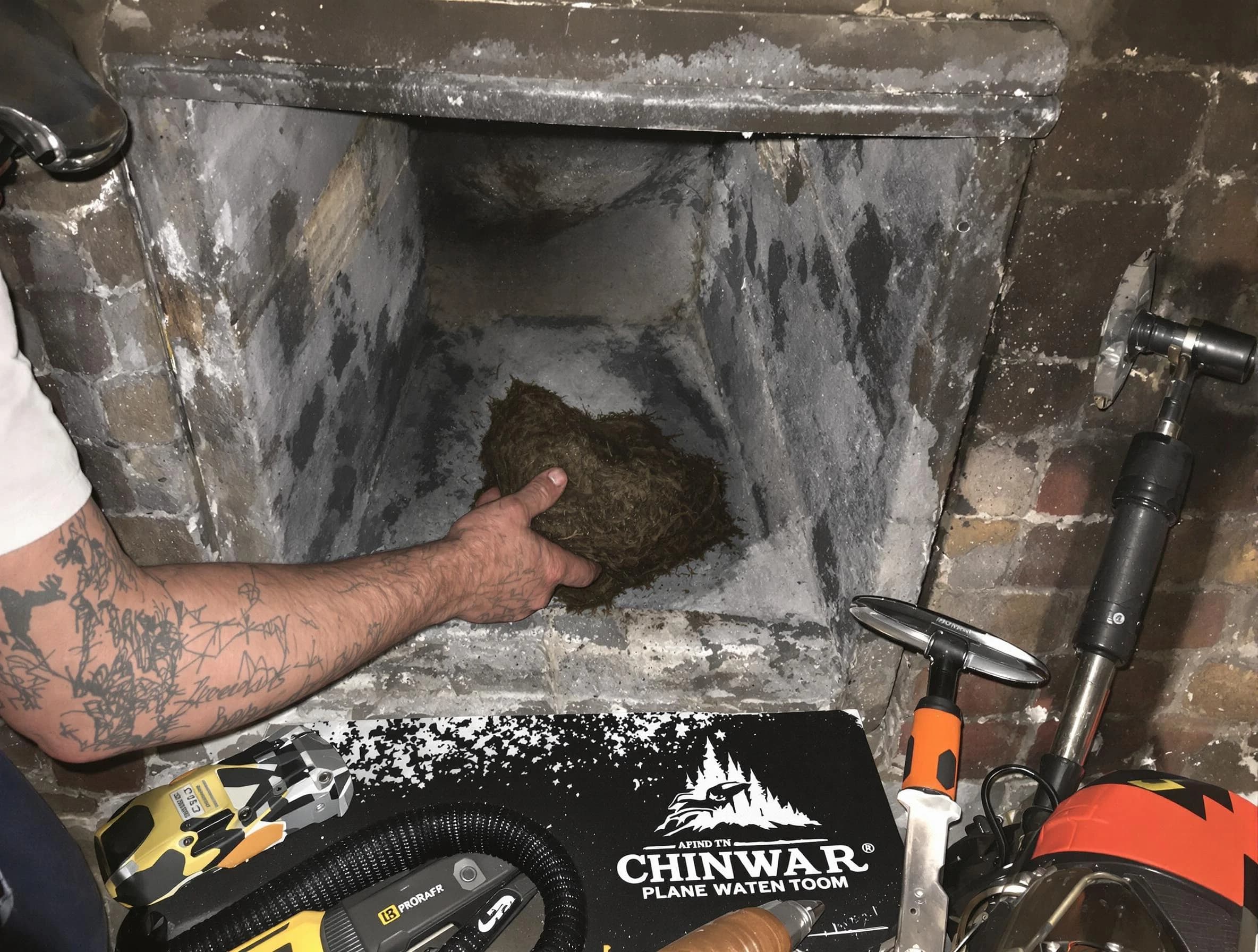 Paterson Chimney Sweep safely removing debris and screening chimney in Paterson, NJ